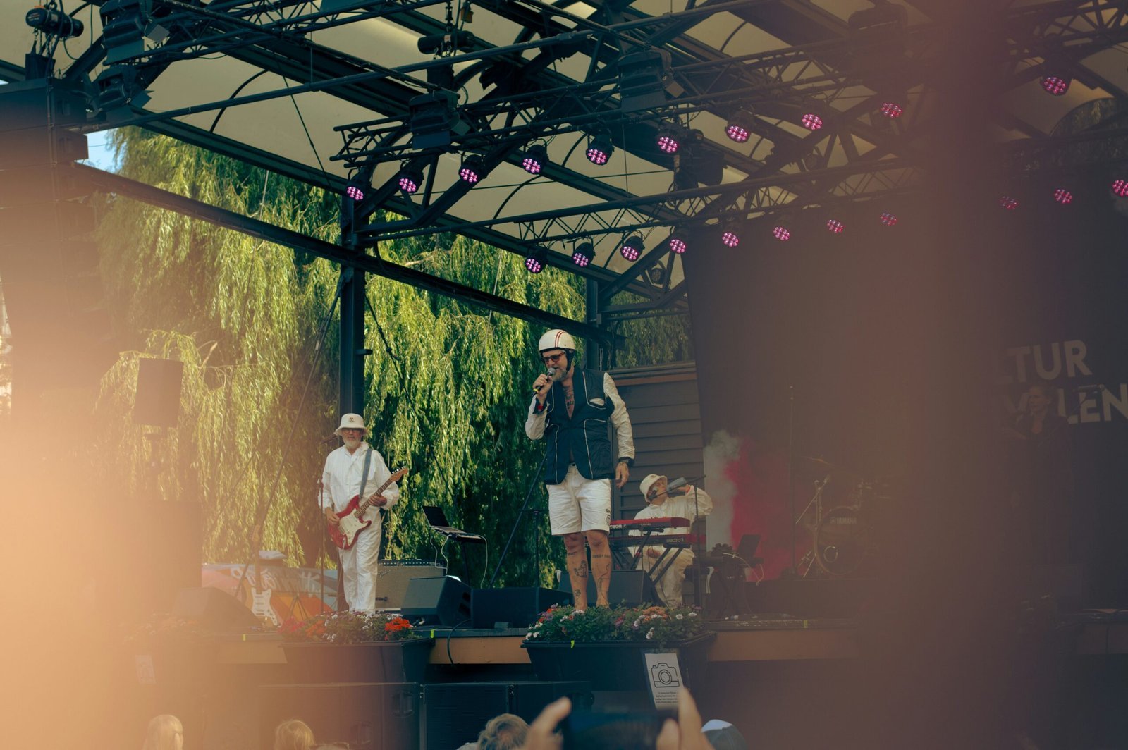 A group of people standing on top of a stage